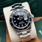 Rolex Submariner Date 40 mm 16610 1999, automático.